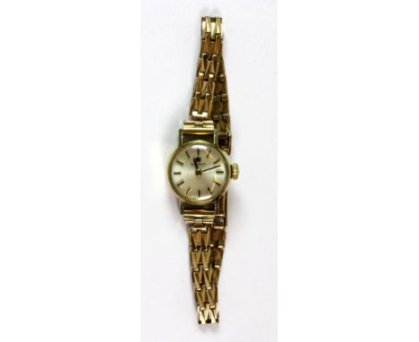 A 9ct gold Tissot lady's wrist watch.