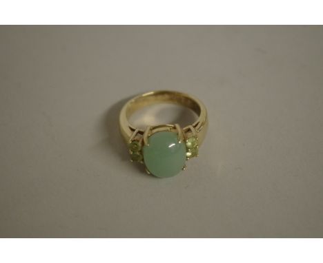 A gold plated ring set cabochon&nbsp;green stone, stamped .925. 