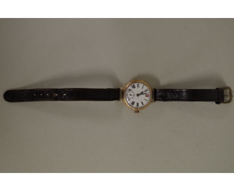 A vintage 9ct gold gentleman's small wristwatch,&nbsp;having white enamel dial with subsidiary seconds dial, manual wind, imp