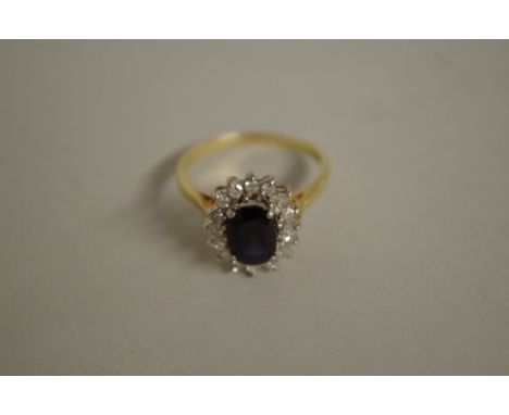 An 18ct gold sapphire and diamond ring. 