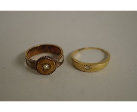 A Victorian 18ct gold and pearl mourning ring,&nbsp;3g; together with a gold diamond set gypsy ring, 2.7g, both (a/f). 