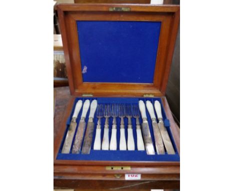 A Victorian mahogany cased set of twelve silver plated and mother of pearl fruit knives and forks, (one handle broken). 