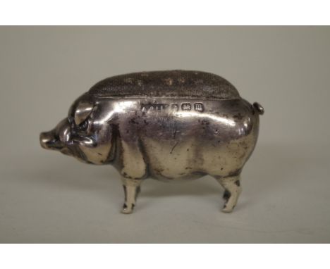 A silver novelty pig pin cushion, makers mark indistinct,&nbsp;Birmingham 1911, 5cm long. 