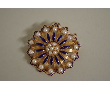 A circular gold floral head blue enamel and pearl brooch/pendant, marked 18k, 4cm diameter (including bale), 10.5g all in. 