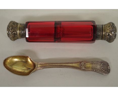 A Cranberry glass double ended scent bottle having plated mounts; together with a silver spoon. 