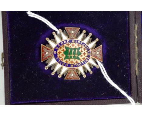 A&nbsp;cased&nbsp;Victorian gilt metal and enamel Tooting Company Drill Badge,&nbsp;inscribed 'Presented to The Tooting Compa