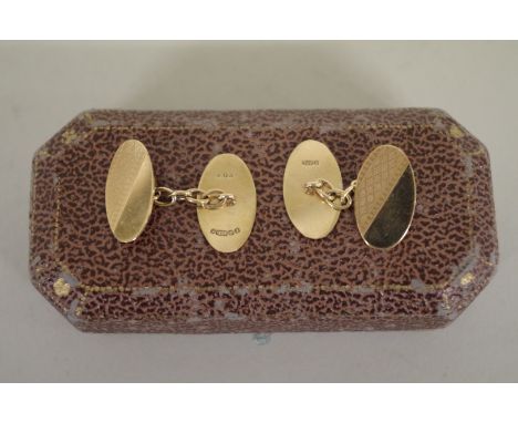 A cased pair of 9ct gold engine turned cufflinks,&nbsp;4.8g. 