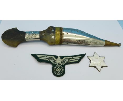 A dagger with horn handle, a uniform patch and an enamel plaque