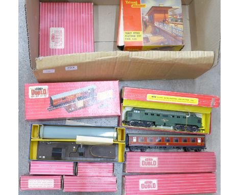 A Hornby Dublo 2232 Co-Co diesel electric locomotive, three railway coaches, four wagons, rail accessories including a ticket