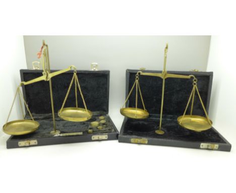 Two cased sets of balance scales, weights incomplete