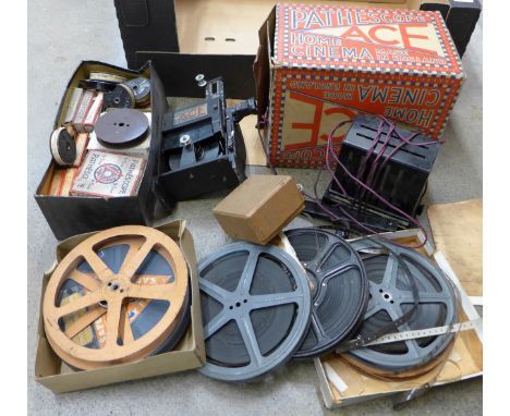 A Pathescope home cinema projector and assorted film reels
