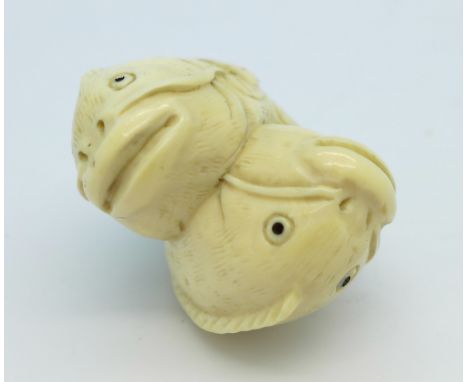 A c.1920 carved ivory fish netsuke