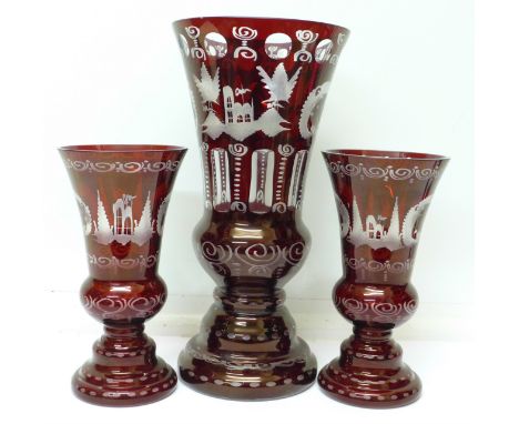 A set of three Bohemian ruby etched glass vases, tallest 30.5cm
