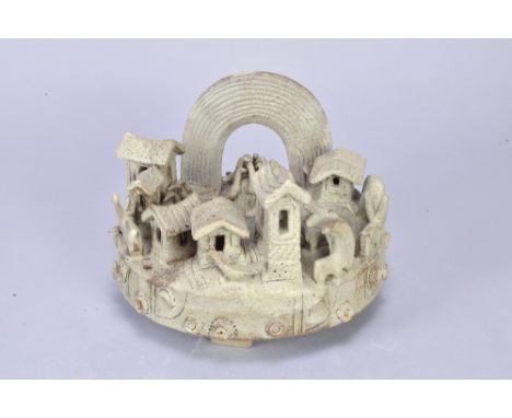 IAN GODFREY (1942-1992); a stoneware ring sculpture raised on tripod feet and mounted with a rainbow, groups of birds, donkey