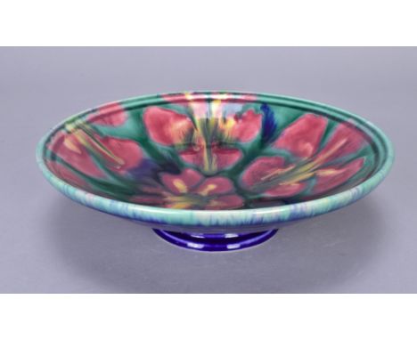 JANICE TCHALENKO (1942-2018) for Poole Studio; an earthenware bowl on splayed foot decorated with flowers, painted JT mark an