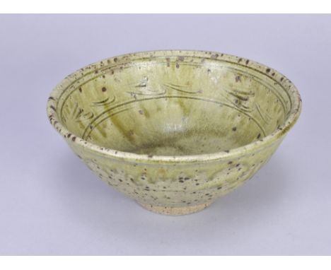 JIM MALONE (born 1946); a stoneware bowl covered in green ash glaze, impressed JM mark, diameter 22.5cm. (D)Additional Inform