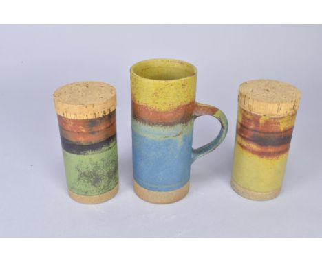 ROBIN WELCH (1936-2019); a tall stoneware mug and a pair of caddies with cork covers, impressed marks, tallest 18.5cm (3). (D