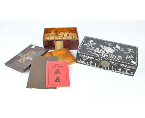 A tin cased part Mahjong set with bamboo tiles and a mother of pearl inlaid hardstone jewellery box containing a similar smal