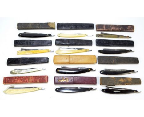 A collection of twelve early 20th century razors including horn and ivory handled examples by Wade & Butcher and a mother of 