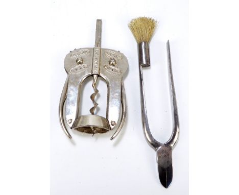 A steel 'Magic Lever Cork Drawer' and a combination of champagne bottle opening tools by W Marples & Son Co of Sheffield (2).
