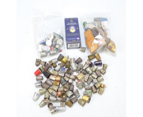 A collection of thimbles to include a boxed set of three Royal commemorative examples, novelty including a Russian doll, a pi