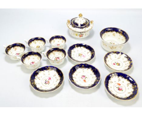 A circa 1840 Samuel Alcock part tea service with royal blue gilt heightened rims centred with flower posies, comprising bowl 