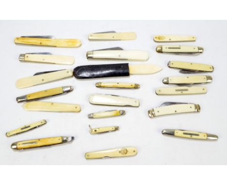 A collection of various late 19th/early 20th century ivory, ivorine and antler bodied pen knives including predominantly doub