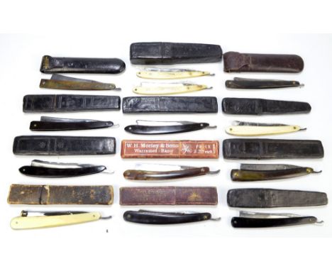 A collection of thirteen late 19th/early 20th century razors including a pair of ivory stud decorated examples by John Pearce