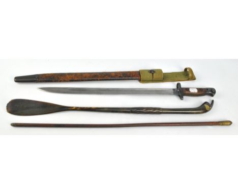 A 1907 military issue bayonet by Wilkinson with military broad arrows and other marks with wooden handle and distressed leath