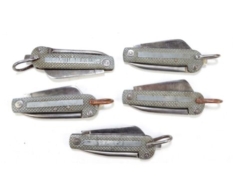 Five large checkered bodied clasp knives, each with single blade and hinged spike with ring loop attachment, one crudely insc