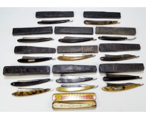 A collection of fifteen late 19th/early 20th century predominantly horn handled razors including examples by Joseph Rodgers, 