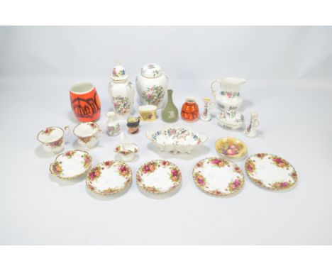 A mixed lot of ceramics including an Aynsley 'Pembroke' pattern ginger jar, two Poole Pottery Delphis vases, and a quantity o