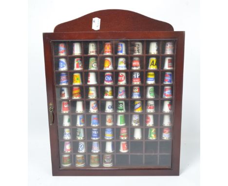 A collection of modern ceramic branded thimbles including Lyle's Golden Syrup, OXO, Typhoo, Diet Coke, Scott's Porridge Oats,
