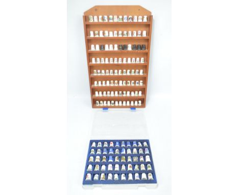 A collection of mainly souvenir and crested ceramic thimbles including a set of nine Route 66 examples bearing different stat