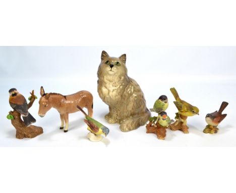 A mixed lot of ceramic figures comprising a Beswick donkey, a Royal Doulton cat and five birds including a Beswick whitethroa