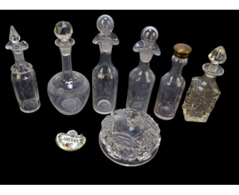 A group of 19th century and later clear glass scent bottles and lidded dish, also a Coalport sherry decanter label (8). CONDI