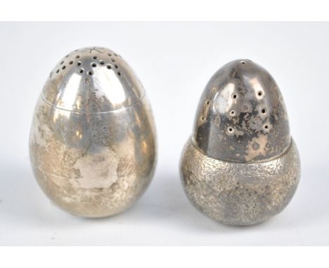 RUPERT FAVELL; a Victorian hallmarked silver pepper modelled as an acorn, and a further egg shaped loaded example, William Hu