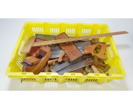 A group of woodworking tools to include planes, saws and drills.