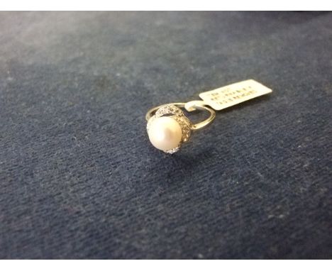 SILVER RING MARKED 925 WITH 'PEARL' AND SURROUNDING WHITE STONES