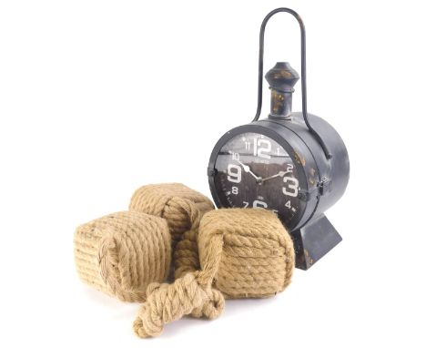 A reproduction quartz ship style clock, with shaped handle, 43cm high, and various entwined rope. 