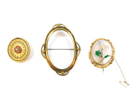 Three Victorian and later Pinchbeck brooches, comprising a Pinchbeck oval framed pendant brooch, 7.5cm x 6cm, another with ce