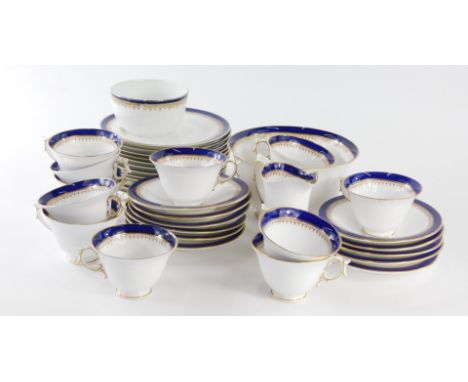 A late 19thC Royal Worcester porcelain tea service, in blue and white with gilt highlights, comprising slop bowl, 18cm dia., 