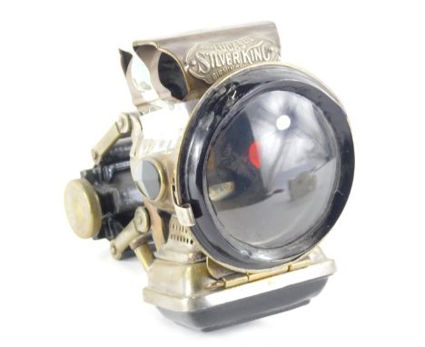 A Lucas vintage Silver King bicycle lamp, with plain circular front glass in brass case with stamp, marked USE ¾inch wick to 