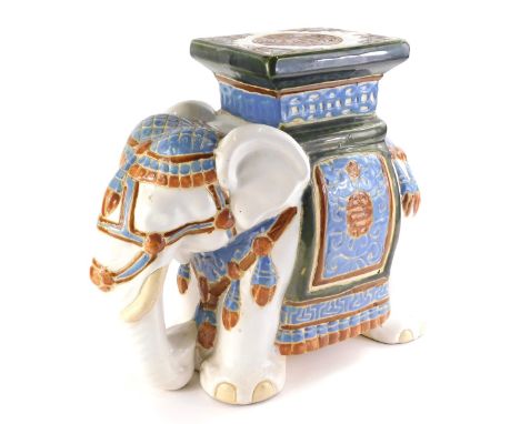 A Chinese ceramic seat modelled as an elephant, in blue and green colours, unmarked, 37cm high. 