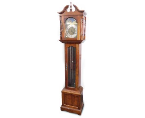 A small longcase clock, the brass dial with moon phase stamped Made In Germany, in a hardwood case, 190cm high.