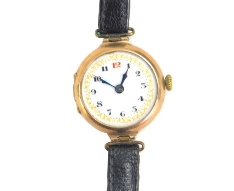 A 9ct gold cased wristwatch, with fancy enamel dial, Arabic numerals and leather strap, 19g all in. 