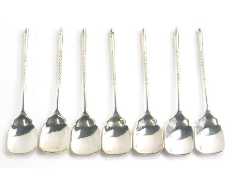 A set of seven tea spoons, each with shovel bowls and entwined stems, unmarked, 12cm long. (7)