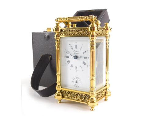 Rapport London. A gilt brass carriage clock with 5cm wide plate with Roman numeric and Arabic dial and subsidiary Arabic seco