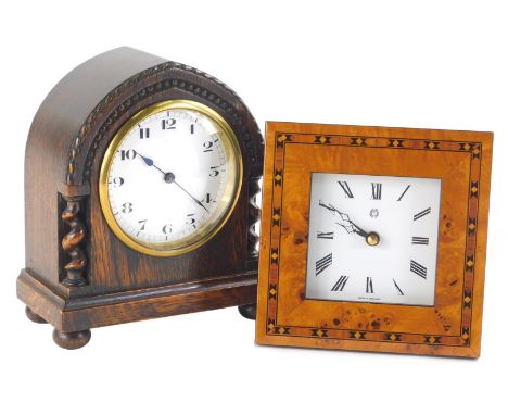 An early 20thC oak mantel clock, with Arabic dial and heavily carved case with barley twist columns and a further parquetry s