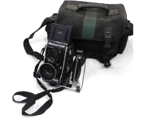 A Mamiya C330 twin-lens reflex camera, case, etc.